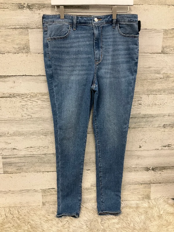 Distressed jeans with bleach spots for a unique appearanceJeans Skinny By American Eagle In Blue, Size: 14