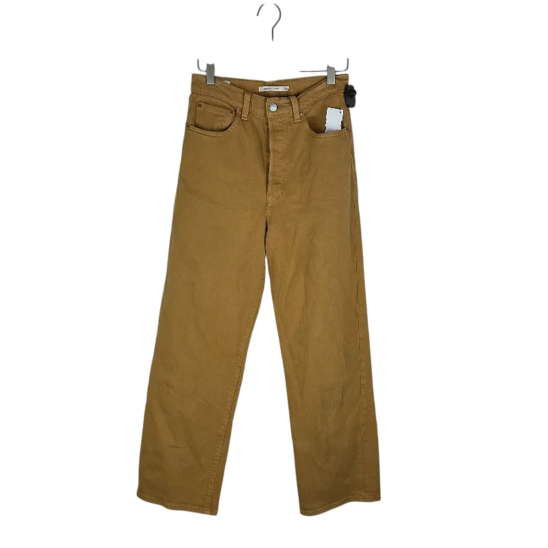 Jeans with a relaxed fit and slight flare at the legs for a retro vibeJeans Boot Cut By Levis In Yellow Denim, Size: 27